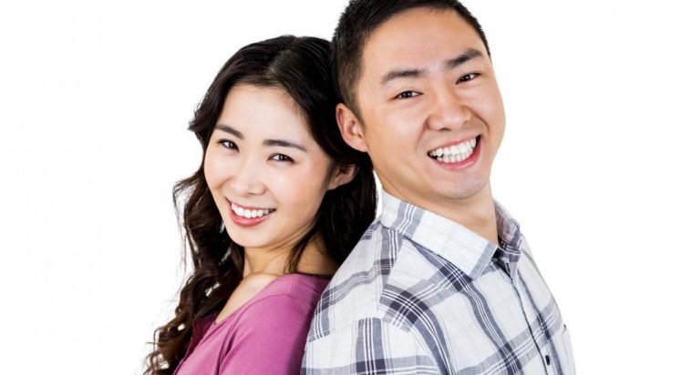 asian-couple-smiling-at-camera